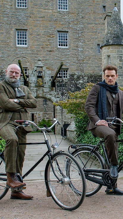 'Outlander' Stars Sam Heughan & Graham McTavish's Yule Log Video Teases The Upcoming 'Men In Kilts'